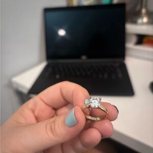 Gold-Tone Solitaire Ring with Round Sparkling Stone